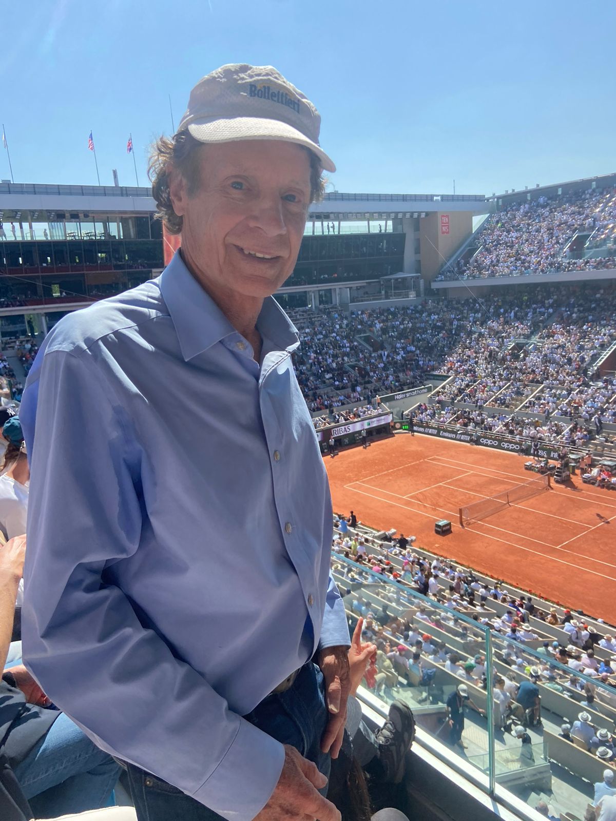 Dr. Marshall Hubsher at Roland Garros, observing Djokovic's match